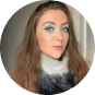 A profile picture of a female with some makeup on